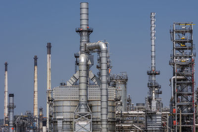 Low angle view of smoke stack against sky