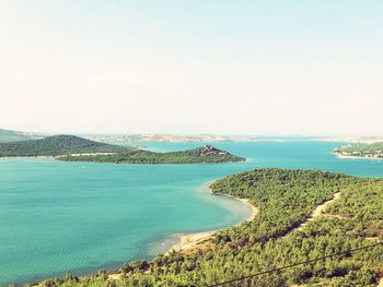 Scenic view of bay against clear sky