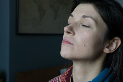 Close-up portrait of woman looking away