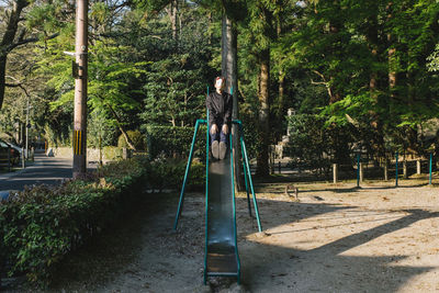 Man wearing animal mask on slide