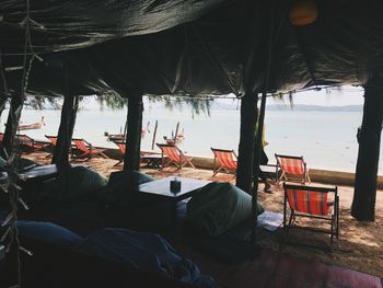 People sitting on chair at beach