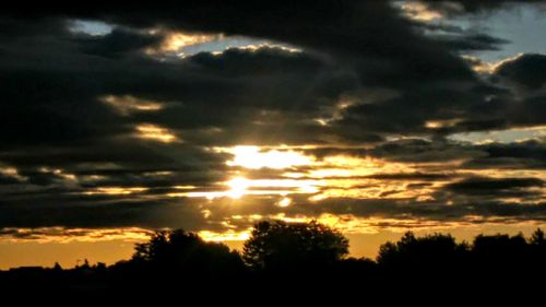 Scenic view of dramatic sky during sunset