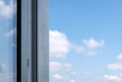 Close-up of window against blue sky
