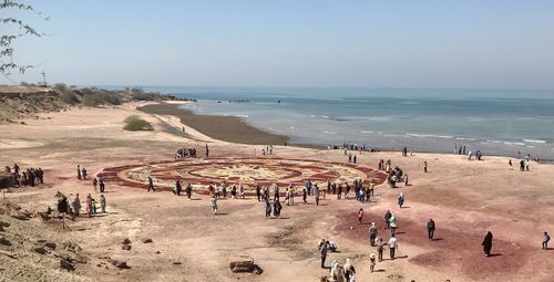 High angle view of people on beach against sky