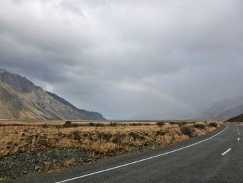 Winding road and mountain against sky