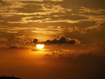 Scenic view of dramatic sky during sunset