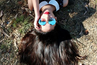 High angle view of girl lying on grass