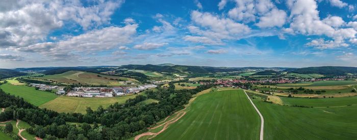 Panoramic view of agricultural landscape against sky