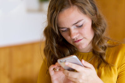 Close-up of woman using phone