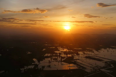 Scenic view of sunset over city