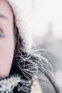 Close-up of woman with frost on hair