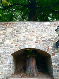 Low angle view of stone wall against building
