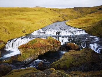 Scenic view of water flowing through rocks