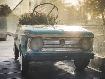 Close-up of vintage car on street