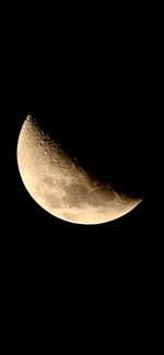 Low angle view of moon against clear sky at night