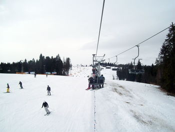 People skiing on snowcapped mountain