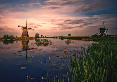 Scenic view of lake against sky at sunset