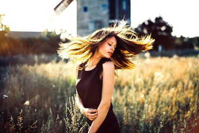 Woman standing on field