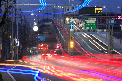 Traffic light trails on road at night