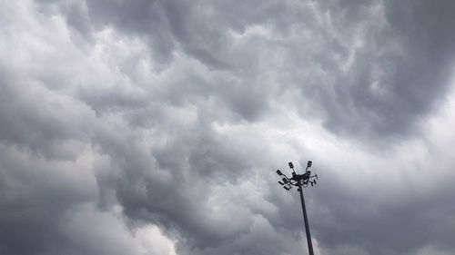 Low angle view of floodlight against sky