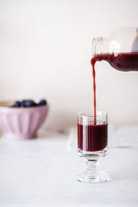 Close-up of wineglass on table