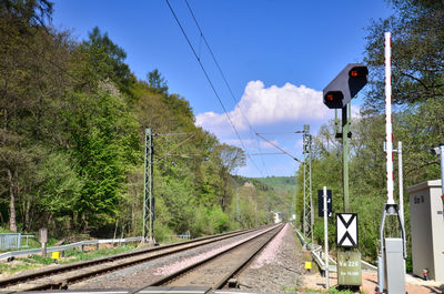 Train on railroad track against sky