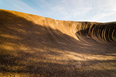 Scenic view of arid landscape against sky