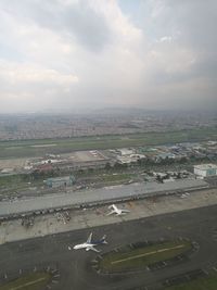 Aerial view of cityscape against sky