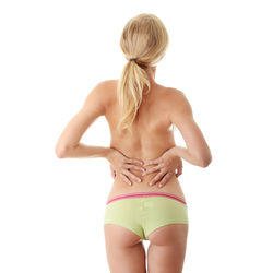 Rear view of woman standing against white background