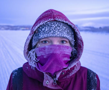 Portrait of young woman wearing warm clothing outdoors during winter