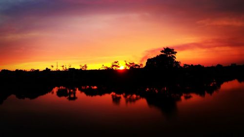 Scenic view of lake at sunset