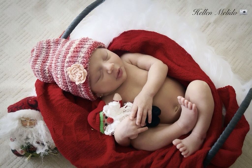 indoors, childhood, cute, high angle view, red, innocence, toddler, baby, home interior, bed, elementary age, toy, babyhood, relaxation, sitting, girls, person, portrait