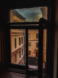 Buildings seen through window of house