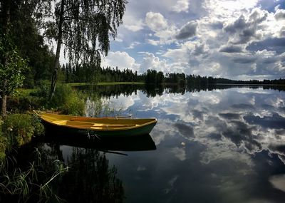 Boats in calm lake