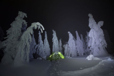 Snow covered rocks at night during winter