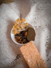 Spices in a bowl on a crumpled tablecloth 