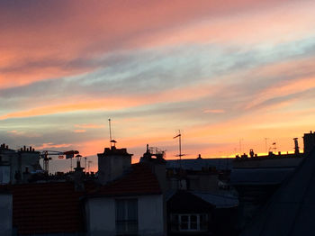 Built structure against cloudy sky at sunset