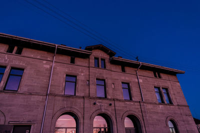 Low angle view of built structure against blue sky