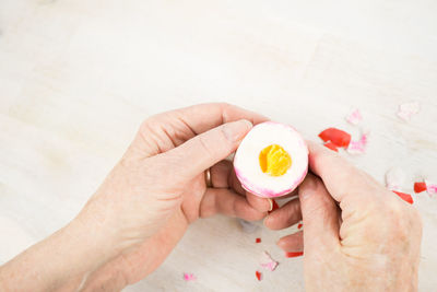 High angle view of woman holding ice cream