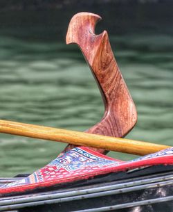 Close-up of metallic structure against sea