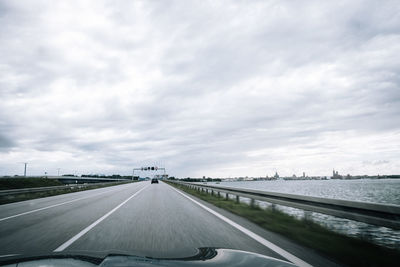 Highway seen through car windshield