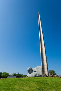 Low angle view of monument against blue sky