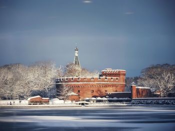 View of buildings against sky during winter