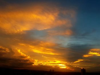 Scenic view of dramatic sky during sunset