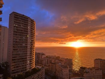 Cityscape against sky during sunset