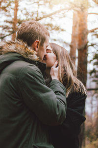 Couple kissing in park