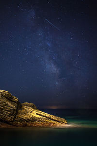 Scenic view of lake against star field at night