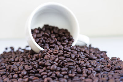 Close-up of roasted coffee beans on table