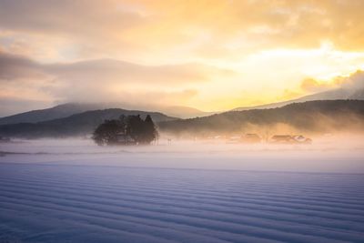 Scenic view of landscape against sky during sunset