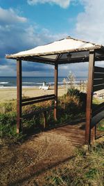 Built structure on beach against sky